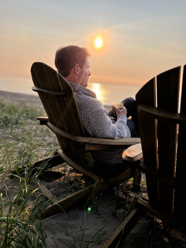 Relaxing by the beach at sunset