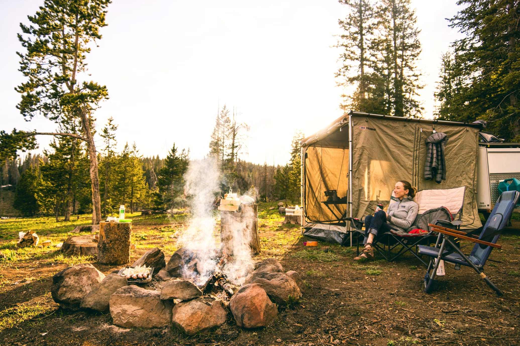 https://unsplash.com/photos/woman-sitting-on-chair-near-tent-uY2UIyO5o5c)